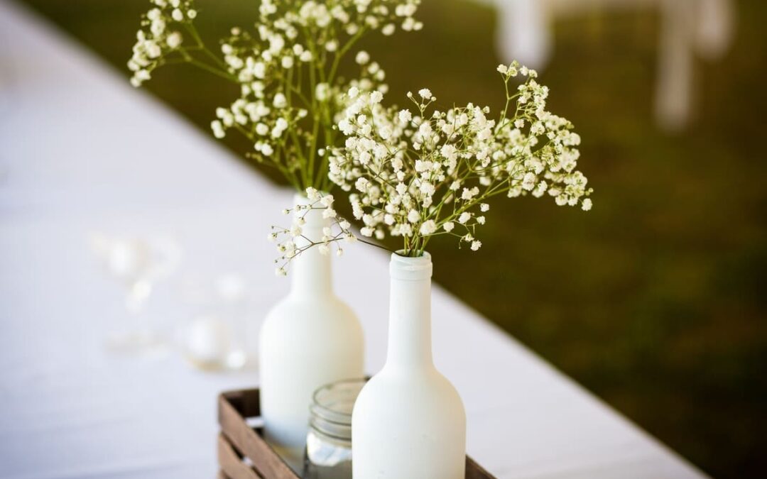 baby breaths flowers inside painted wine bottle