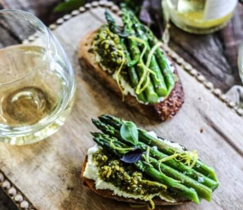 Bruschetta with warm goat cheese, roasted asparagus, and pistachio pesto