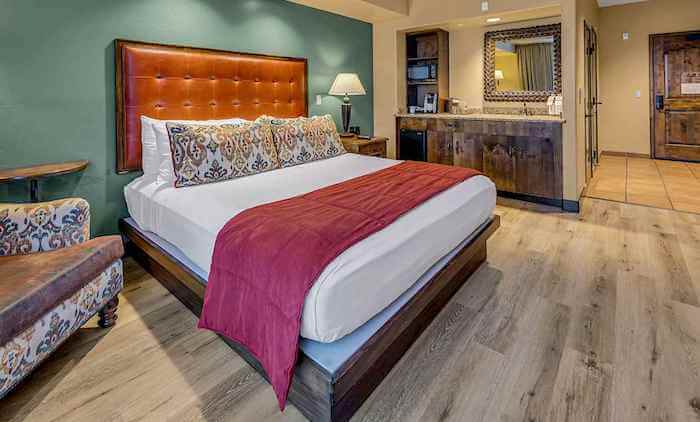 bedroom at rancho murieta in hotel with bed and counter and chair