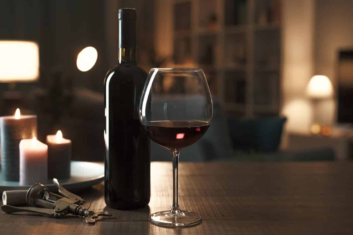 wine bottle and wine glass with red wine