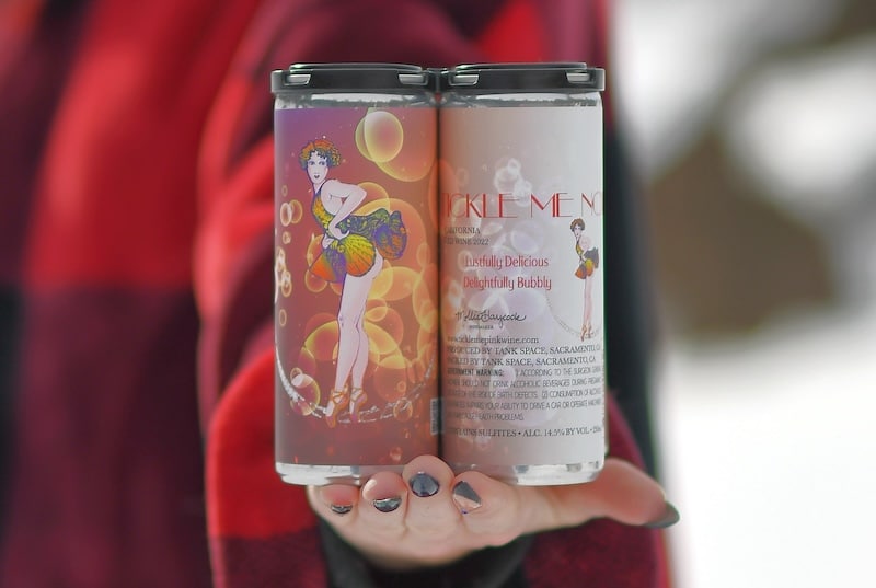 women holding cans