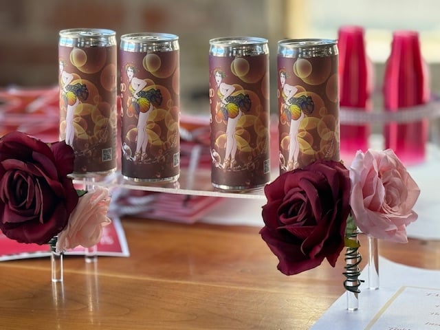 red wine cans on table