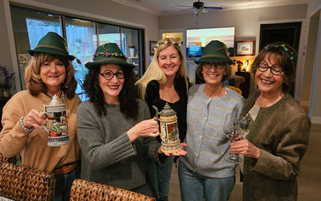 Women toasting with beer steins