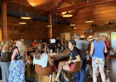 Wide outdoor seating area with tables and space for guests to relax and enjoy their tasting.